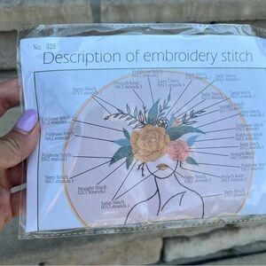 Female face with flower wrest embroidery kit